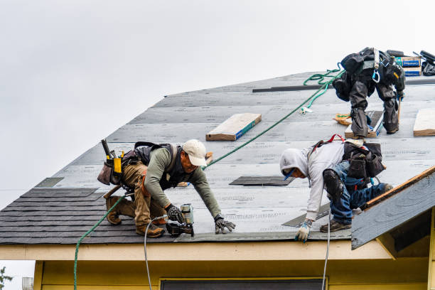 Professional Roofing technician working in Merlin, OR